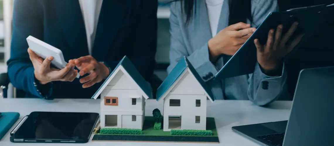 A property valuer and a real estate agent discussing a property in Adelaide